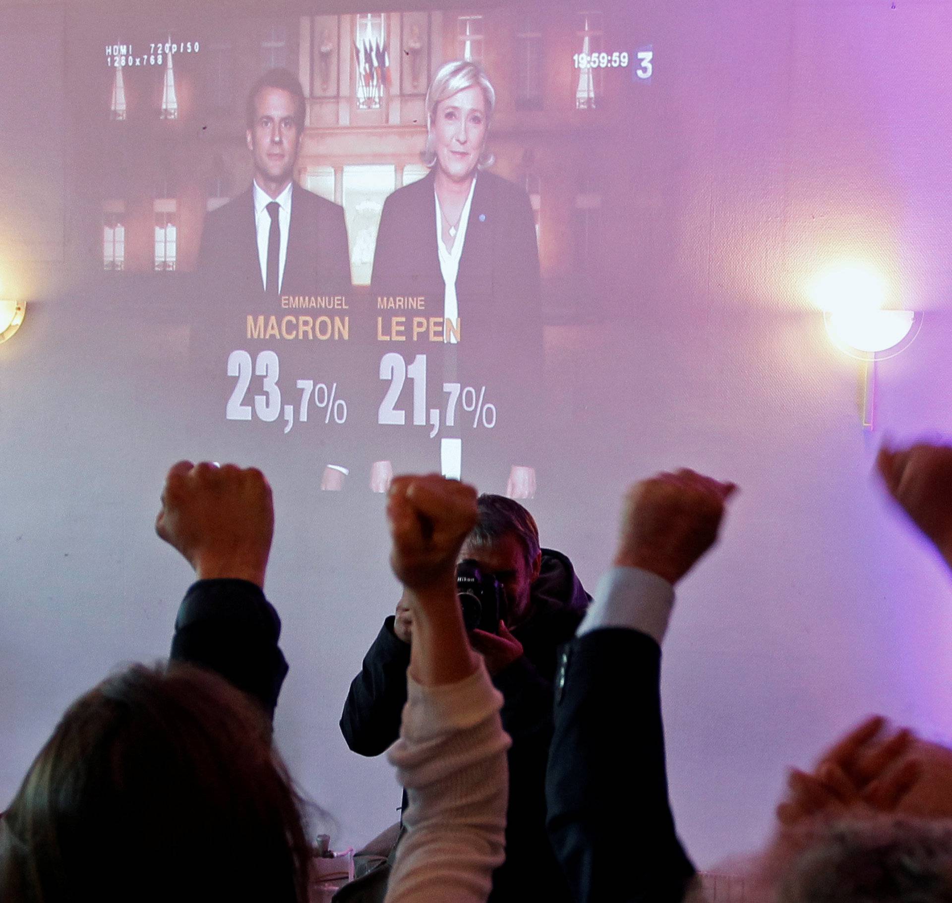 Supporters of Marine Le Pen, French National Front (FN) political party leader and candidate for French 2017 presidential election, react after early results in the first round of 2017 French presidential election in Lyon