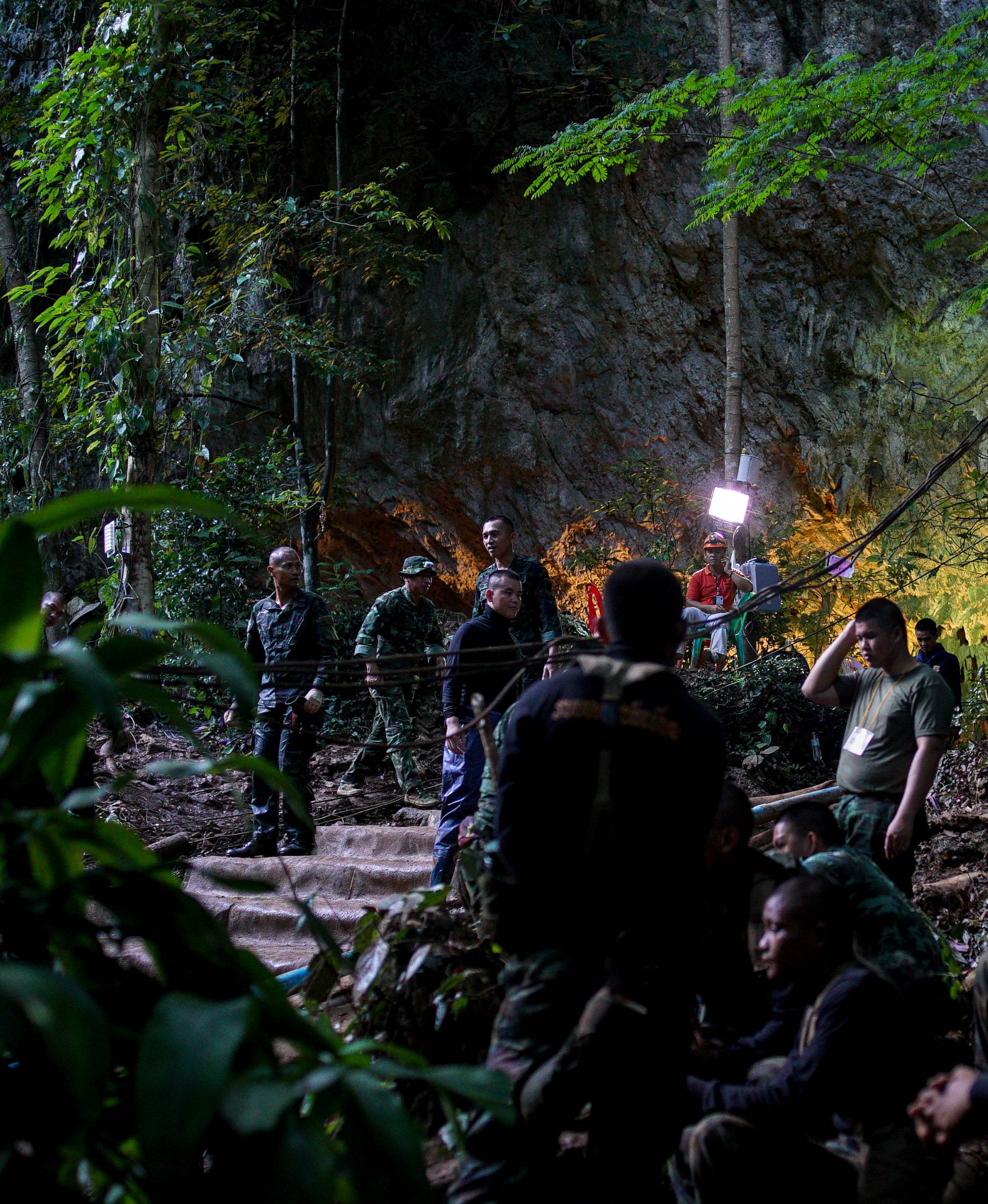 Military personnel gather as they prepare to go in to Tham Luang cave complex, as members of an under-16 soccer team and their coach have been found alive according to local media in the northern province of Chiang Rai