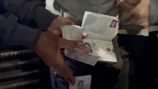 Passports believed to belong to killed World Central Kitchen (WCK) workers are displayed in Deir al-Balah