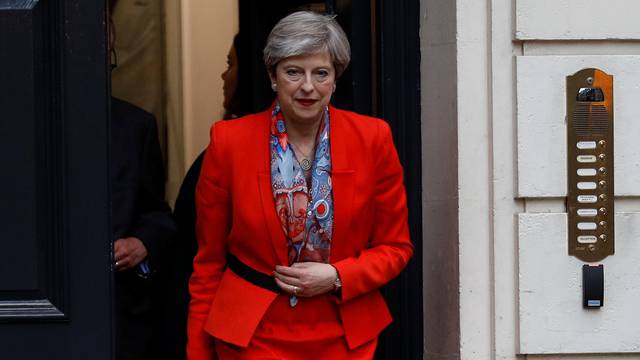 Britain's Prime Minister Theresa May leaves the Conservative Party's Headquarters after Britain's election in London