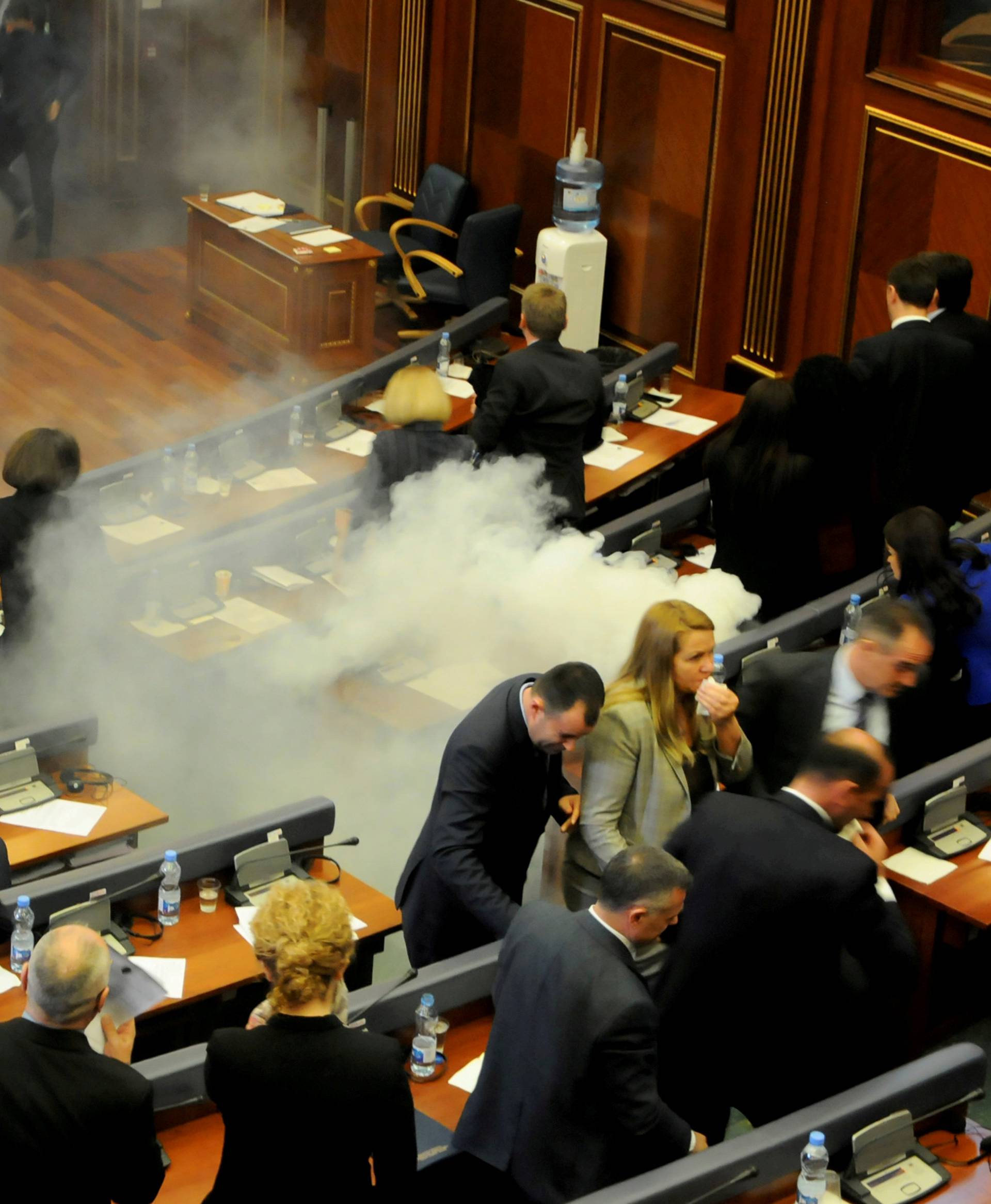 Kosovo opposition politicians release tear gas in parliament to obstruct a session in Pristina