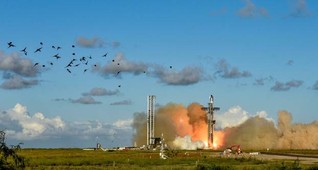 A SpaceX Super Heavy booster carrying the Starship spacecraft lifts off on its 11th test flight