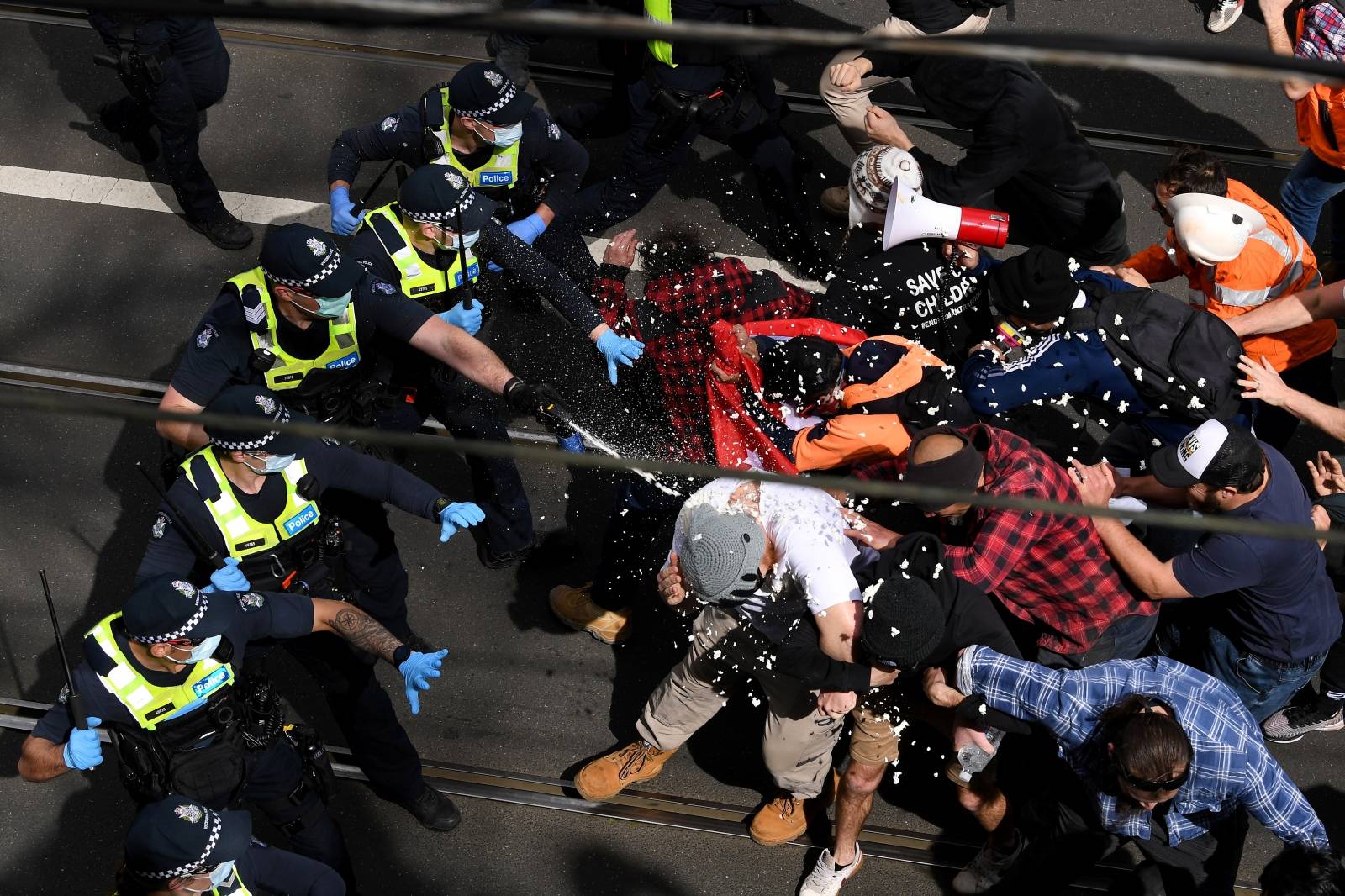 Victoria police clash with protesters during a "The Worldwide Rally for Freedom" demonstration in Melbourne