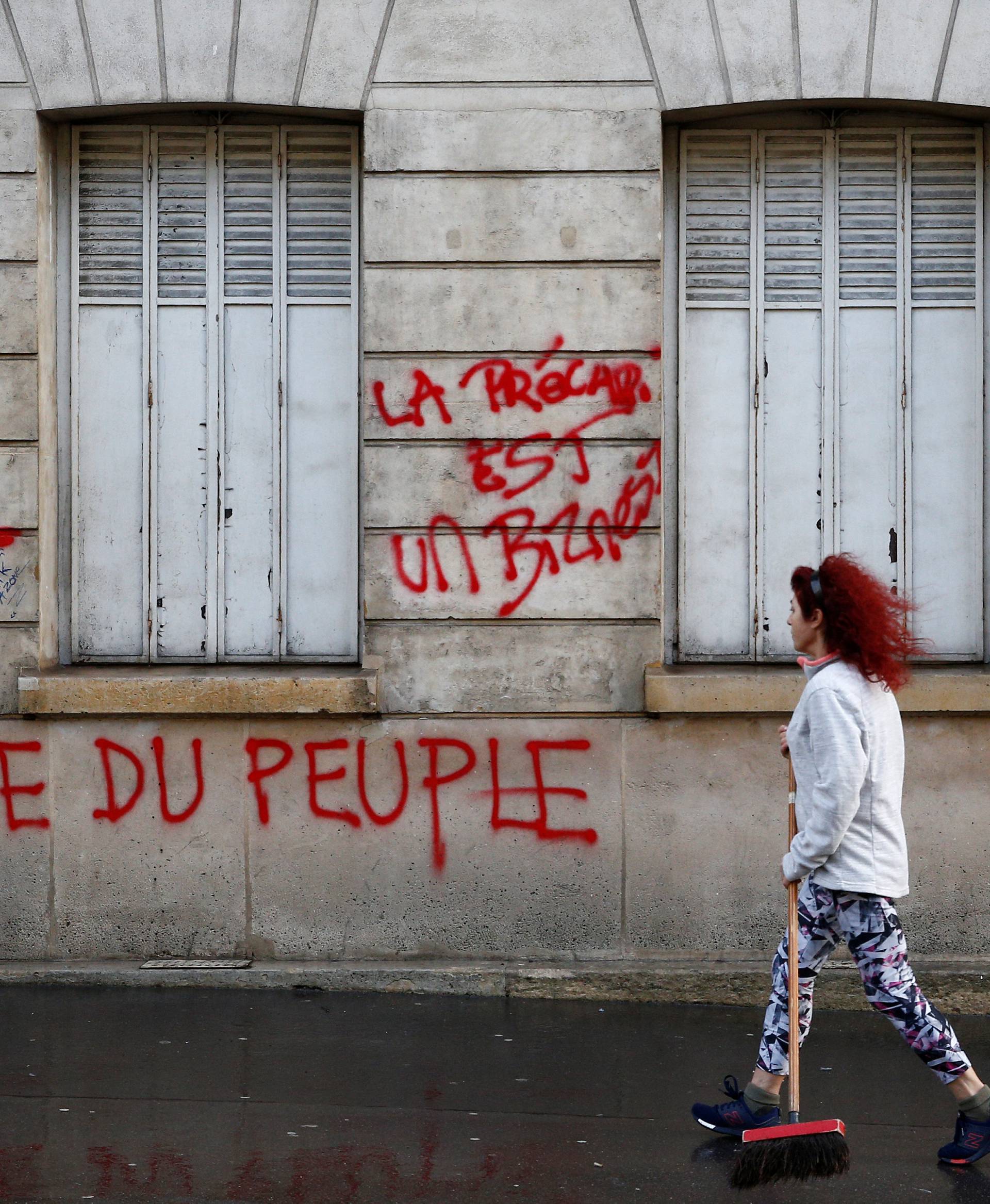 Graffiti is written on the facade of a building the day after clashes during a national day of protest by the "yellow vests" movement in Paris