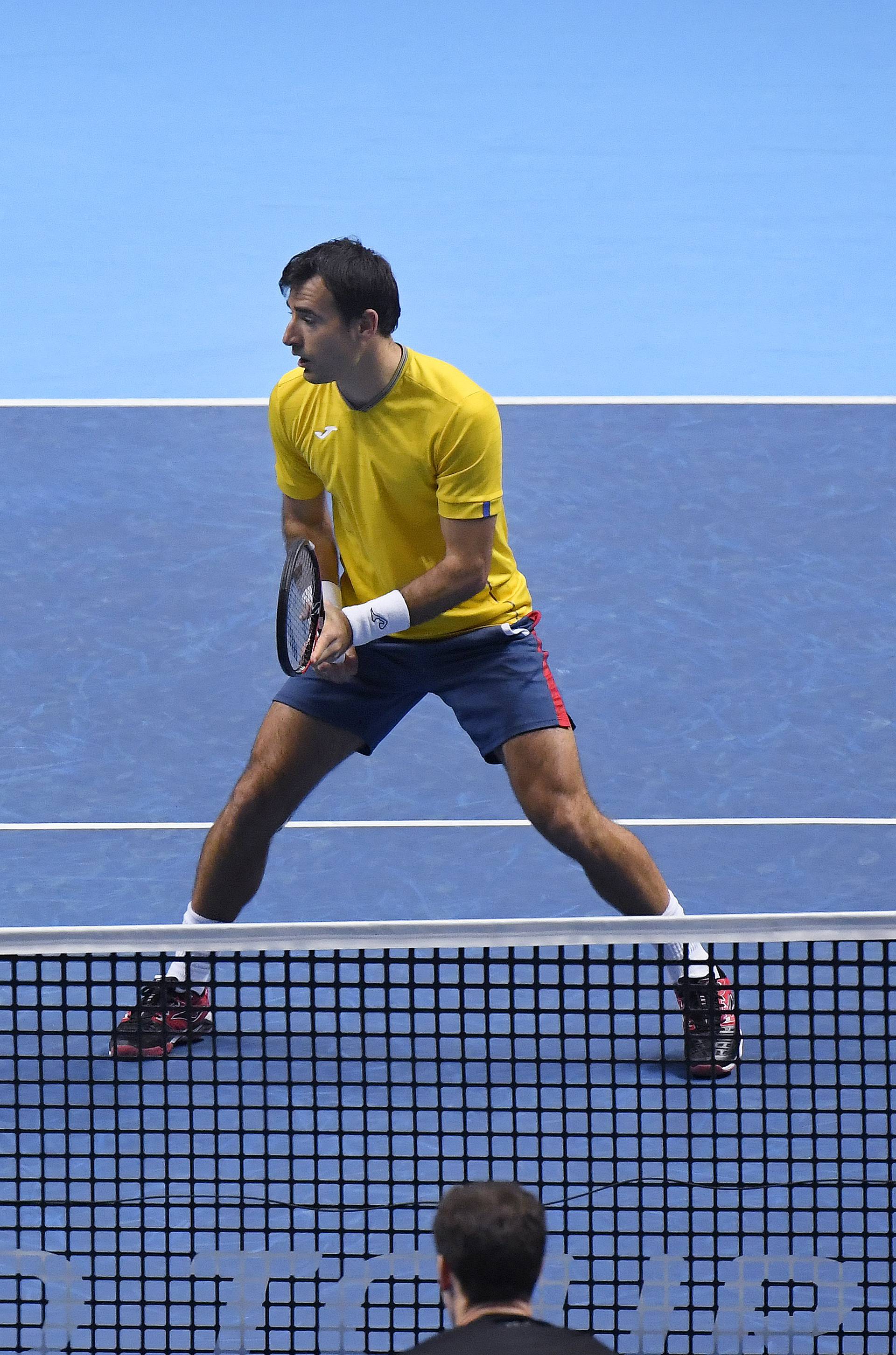 Great Britain's Jamie Murray (bottom) during his doubles match with Brazil's Bruno Soares against Croatia's Ivan Dodig and Brazil's Marcelo Melo