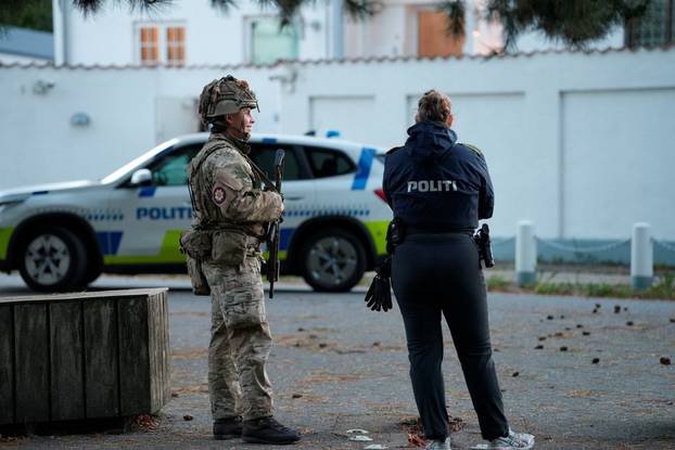 Police officers investigate two blasts near Israel's embassy in Copenhagen