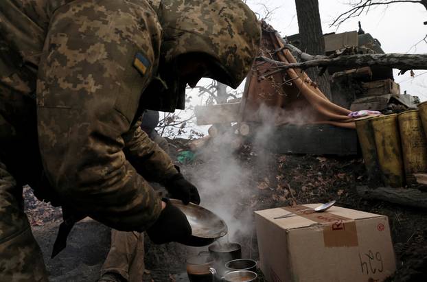 The Ukrainian service members fight and stay warm in the Donetsk region