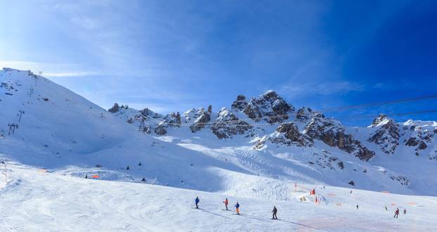 View of snow covered Courchevel slope in French Alps. Ski Resort