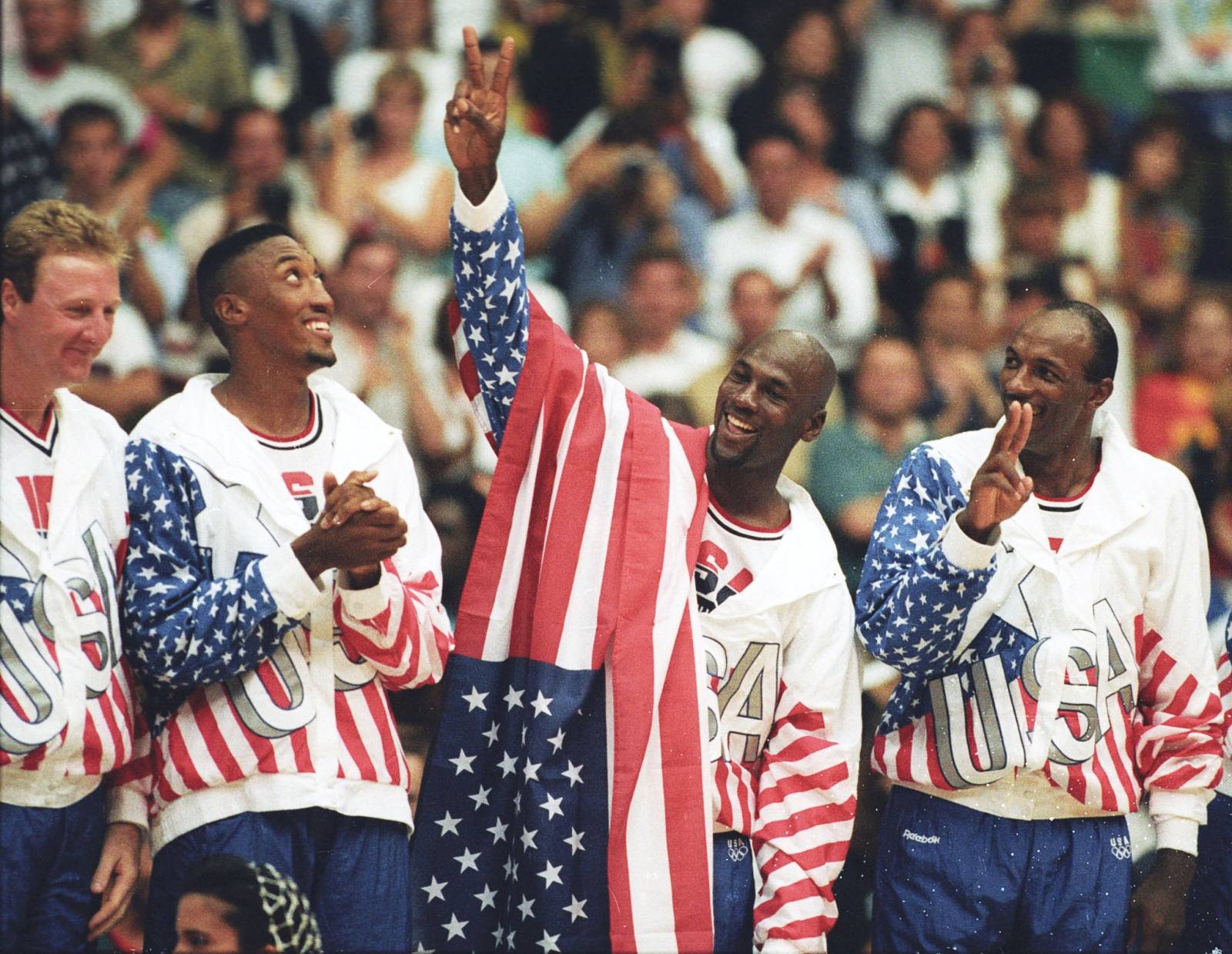 FILE PHOTO: U.S. basketball player Michael Jordan flashes a victory sign as he stands with team mates Larry Bird, Scottie Pippen and Clyde Drexler after winning the Olympic gold in Barcelona