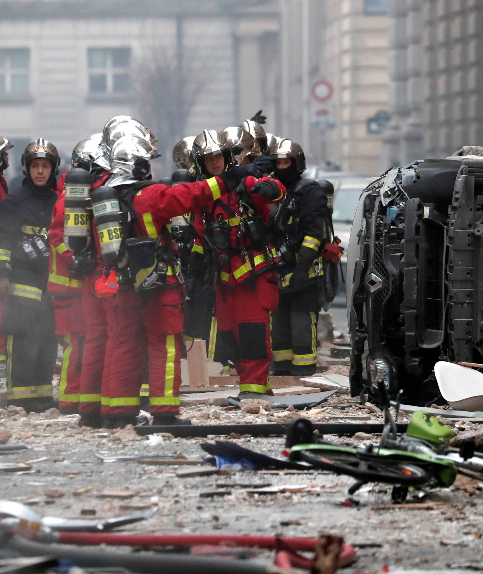 Firemen work at the site of an explosion in a bakery shop in the 9th District in Paris