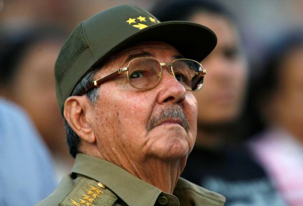 FILE PHOTO - Raul Castro looks up during an event in celebration of the 50th anniversary of the assault of the presidential palace during the regime of Fulgencio Batista, in Havana