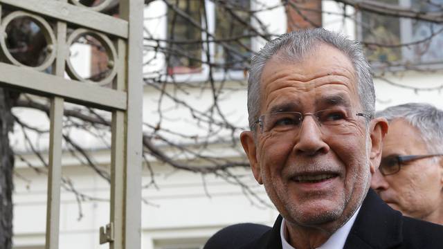 Austrian presidential candidate Van der Bellen, who is supported by the Greens, leaves a polling station in Vienna