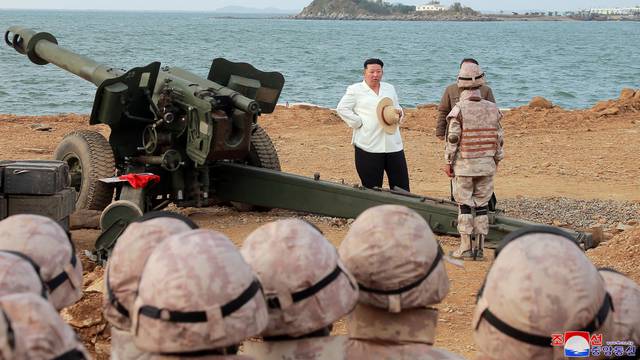 North Korea's leader Kim Jong Un oversees military drills at an undisclosed location in North Korea