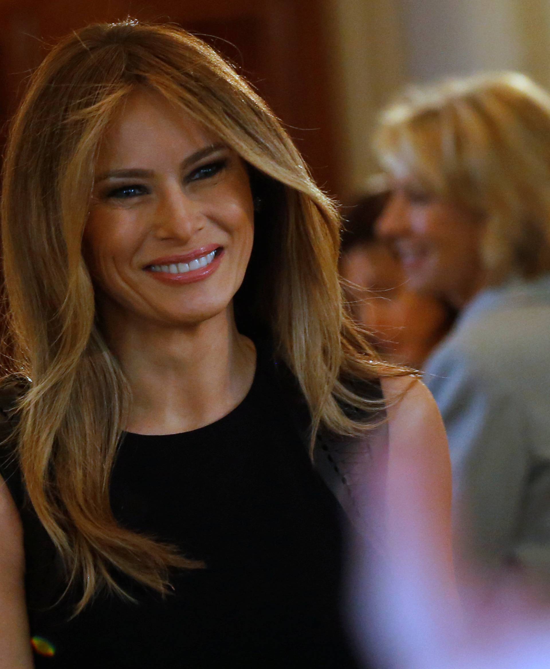 Melania Trump arrives to join her guests for an International Women's Day luncheon at the White House in Washington