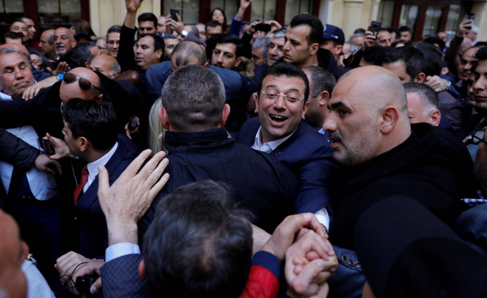 Main opposition Republican People's Party  mayoral candidate Ekrem Imamoglu greets his supporters during a gathering in Istanbul