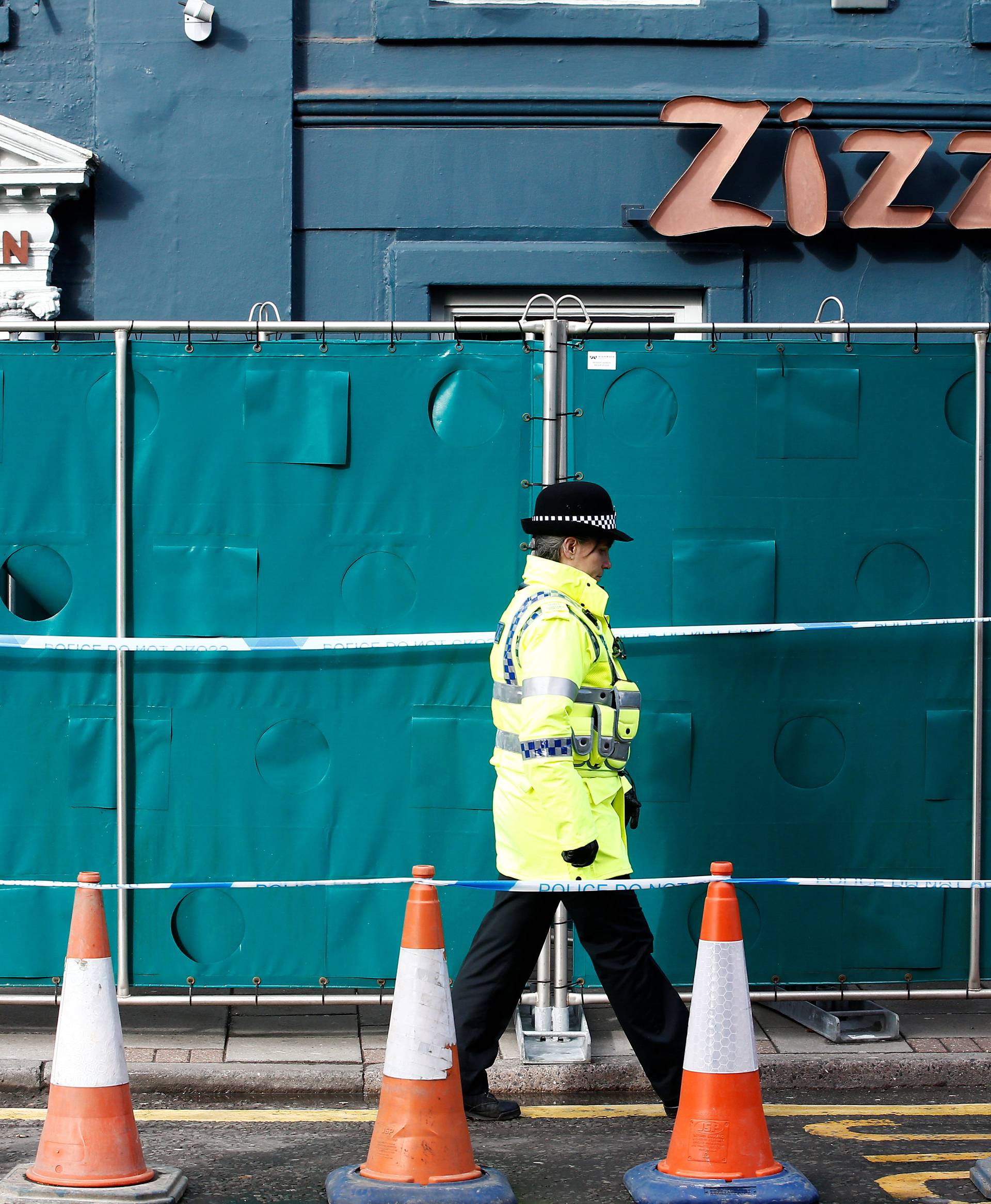 A police officer stands on duty outside a restaurant which has been secured as part of the investigation into the poisoning of former Russian inteligence agent Sergei Skripal and his daughter Yulia, in Salisbury