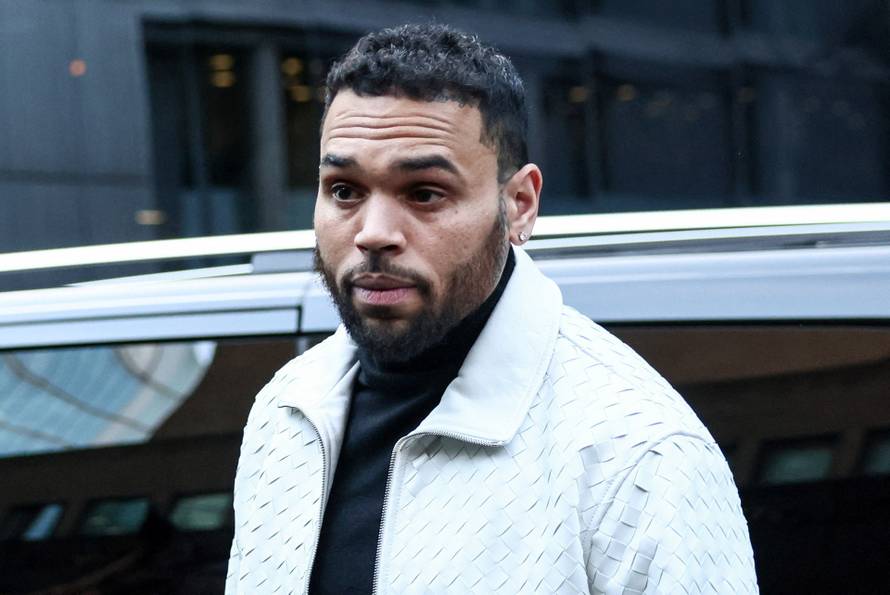 U.S. singer Chris Brown appears outside the Southwark Crown Court, in London