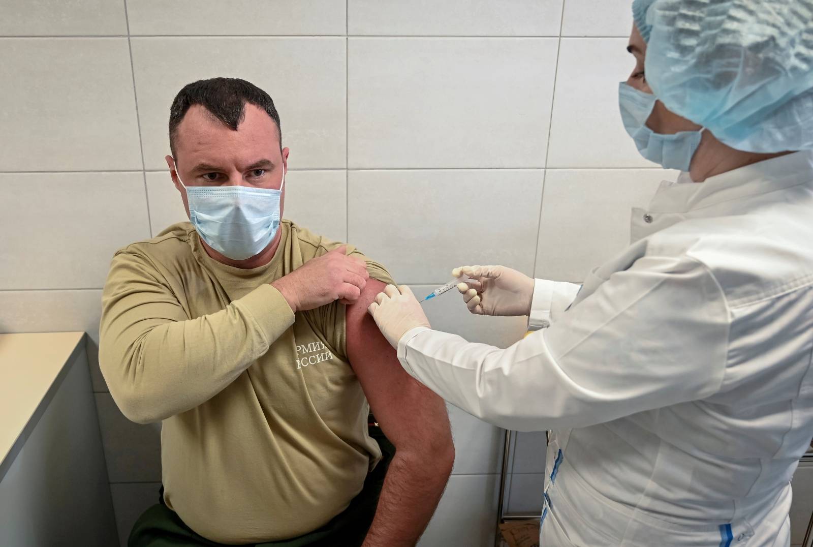 FILE PHOTO: A Russian Army service member receives an injection with Sputnik V (Gam-COVID-Vac) vaccine against the coronavirus disease (COVID-19) at a clinic in the city of Rostov-On-Don