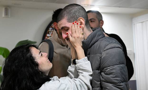 Handout pictures of hostage Or Levy reunited with his family