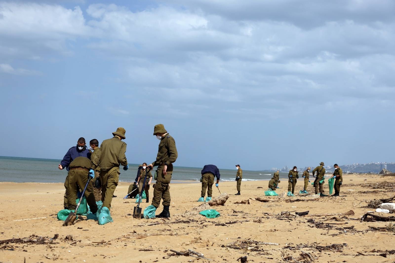 Israel's beaches blackened by tar after offshore oil spill