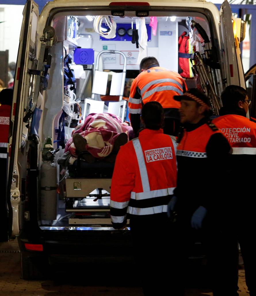 People affected by a deadly train derailment are transferred and treated at the Caseta Municipal in the town of Adamuz
