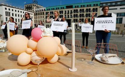 People working in the wedding industry protest against restrictions in the business in front of the Brandenburg Gate, following the coronavirus disease (COVID-19) outbreak in Berlin