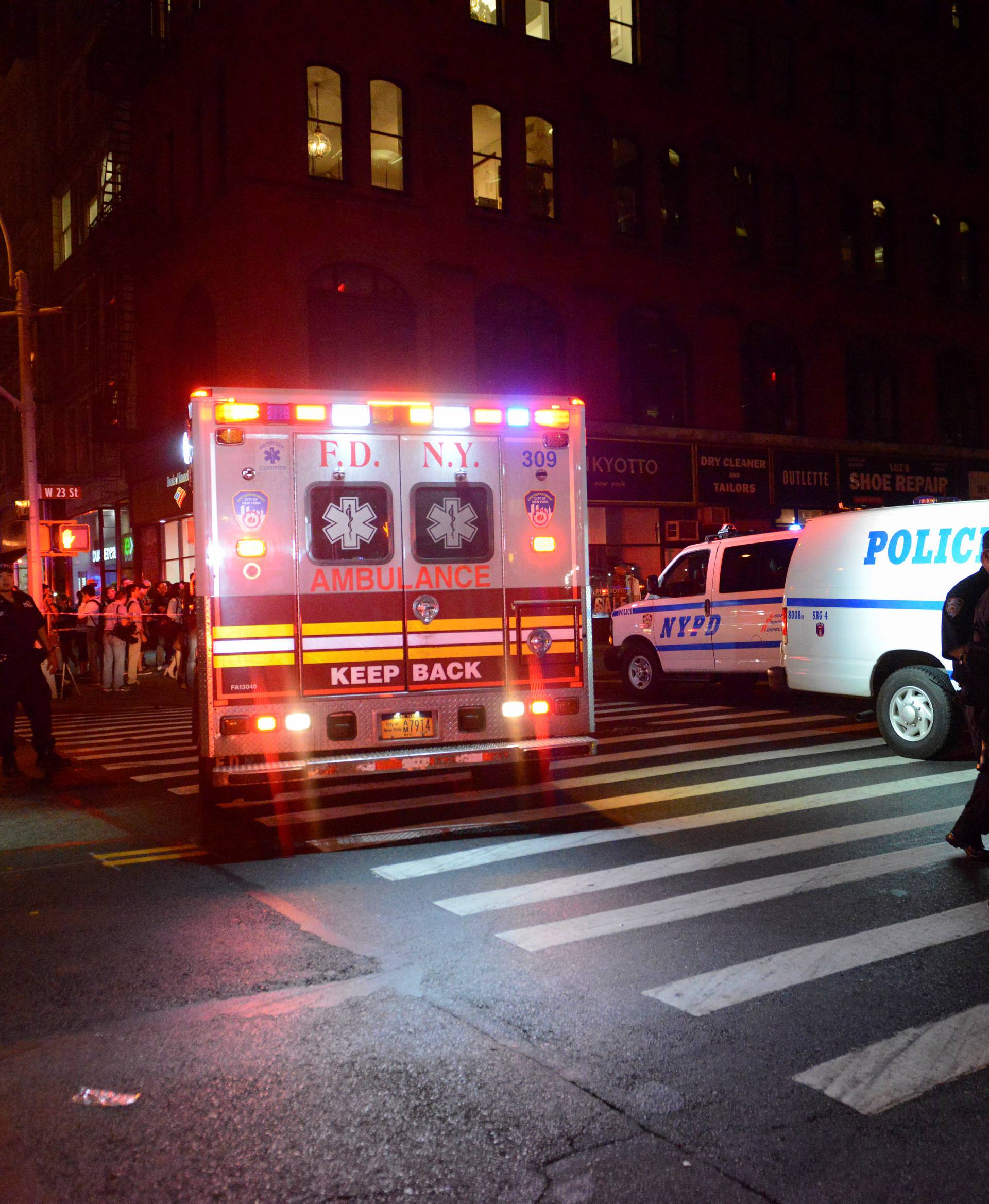 New York City police and firefighters stand near site of explosion in New York