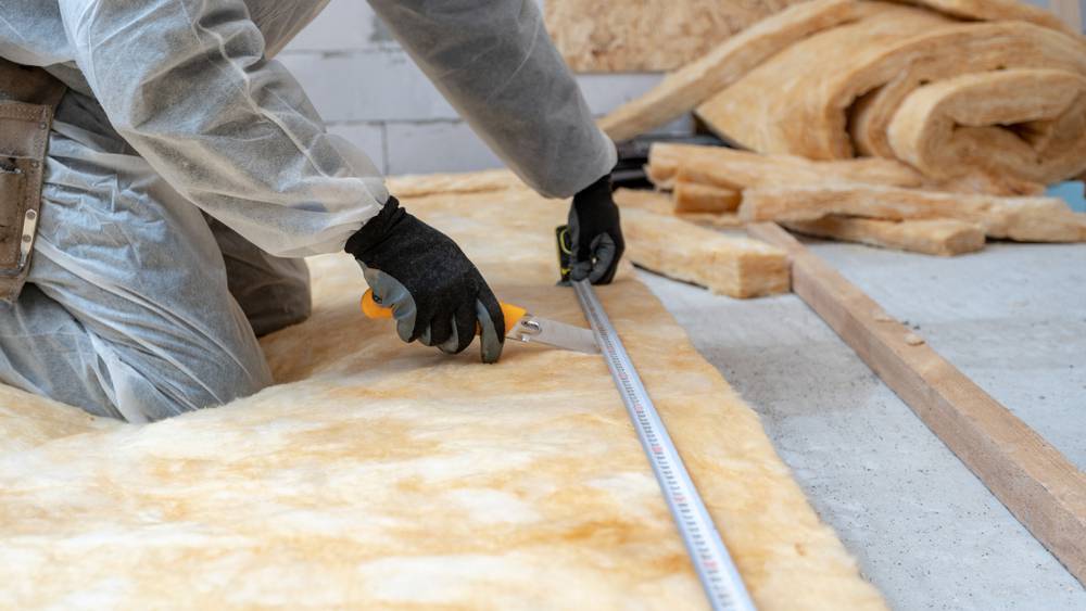 Cropped,View,Of,Professional,Workman,In,Protective,Workwear,Using,Knife