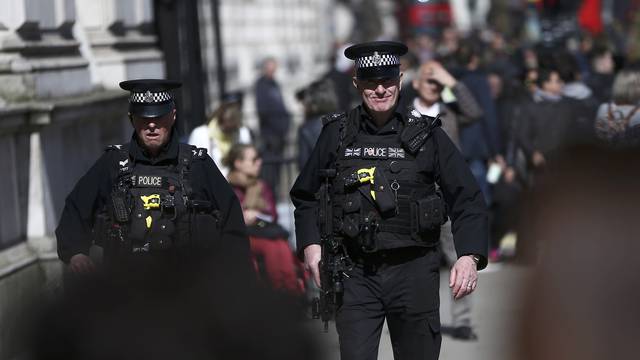 Armed police patrol the streets following the attack in Westminster earlier in the week, in central London