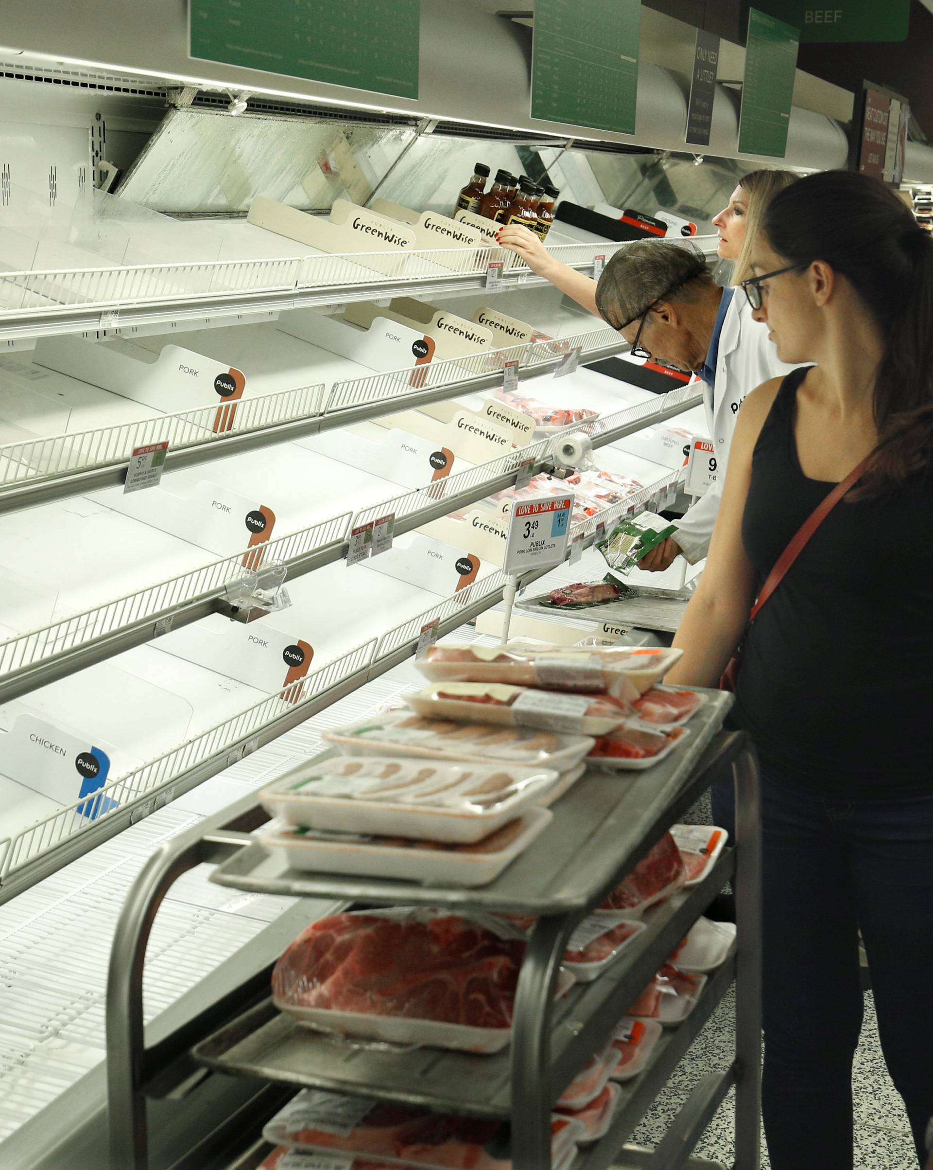 Empty shelves greet shoppers at a supermarket ahead of Hurricane Irma making landfall in Kissimmee