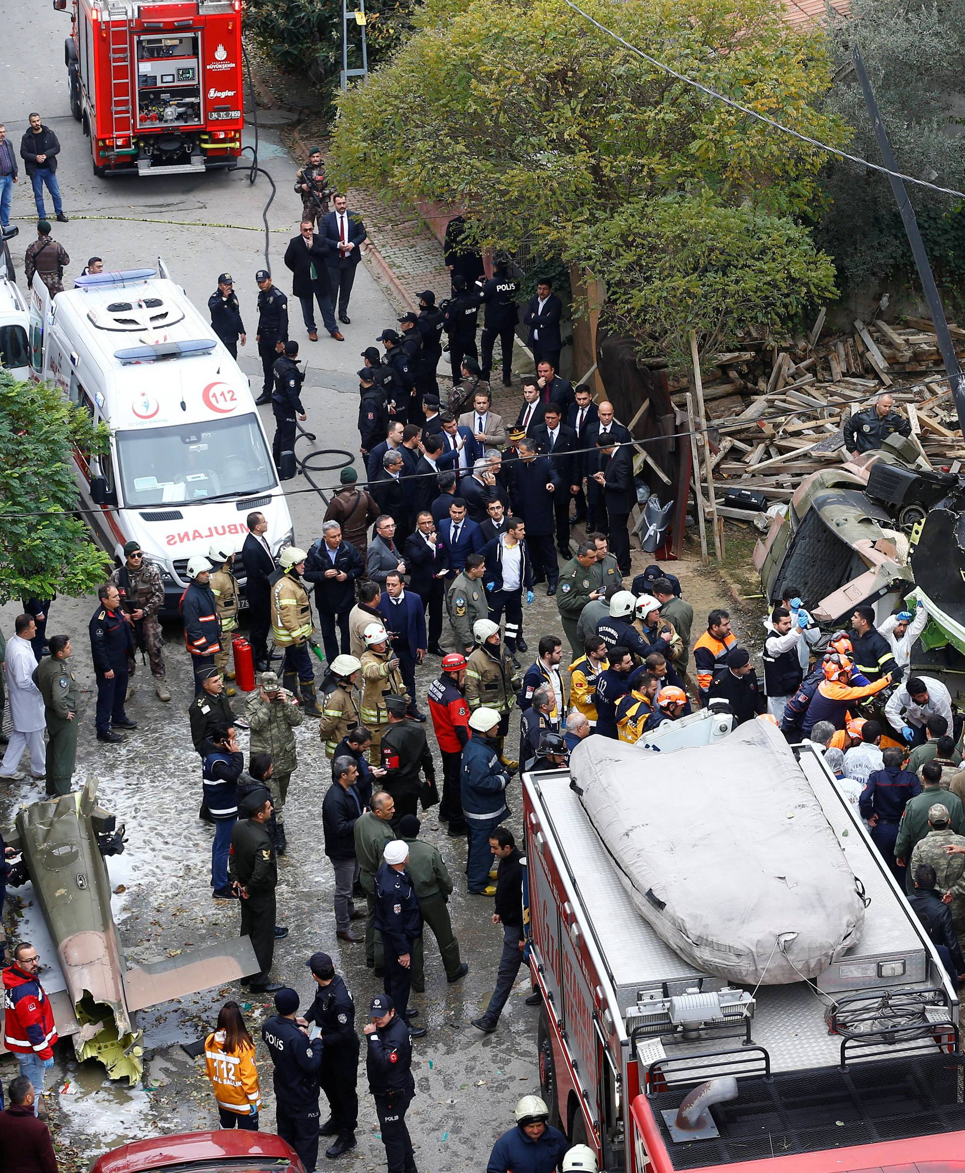 Rescue workers and investigators work at the site of a helicopter crash in Istanbul