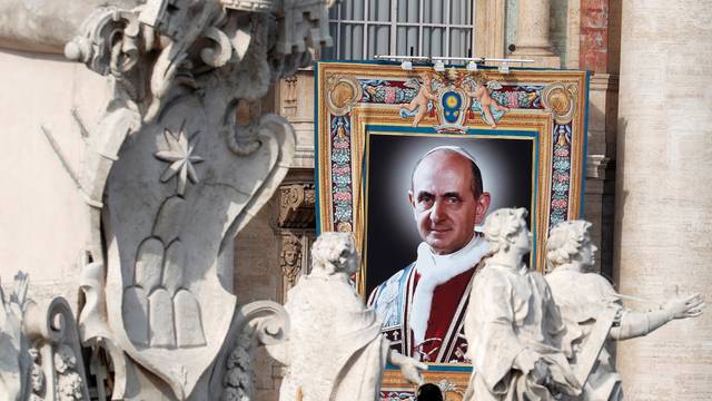 A picture of Pope Paul VI is seen during a Mass for his canonisation at the Vatican