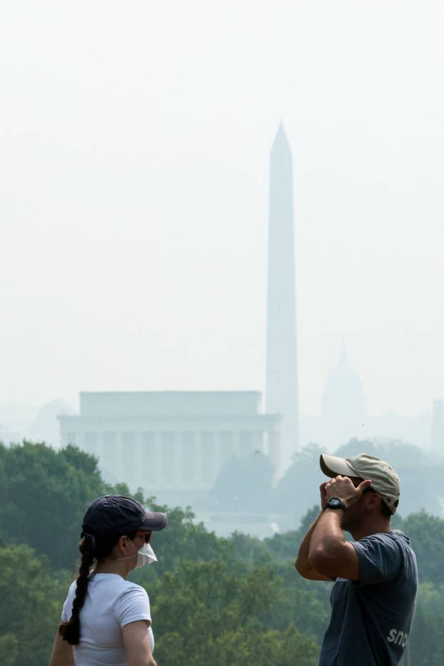 Smoke from Canadian wildfires clouds the National Mall and monuments in Washington