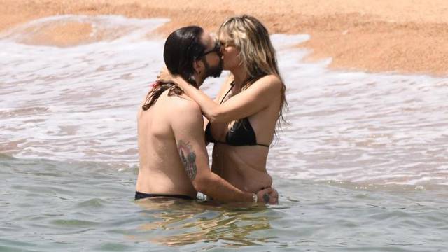 *EXCLUSIVE* *WEB MUST CALL FOR PRICING* Heidi Klum and Tom Kaulitz pack on the PDA in the sweltering Italian heat during a day at the beach at Cala di Volpe in Sardinia.