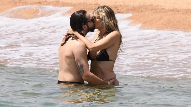 *EXCLUSIVE* *WEB MUST CALL FOR PRICING* Heidi Klum and Tom Kaulitz pack on the PDA in the sweltering Italian heat during a day at the beach at Cala di Volpe in Sardinia.