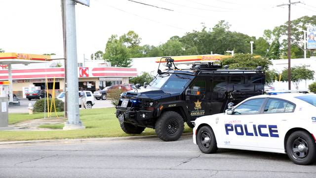 Police officers block off a road after a shooting of police in Baton Rouge