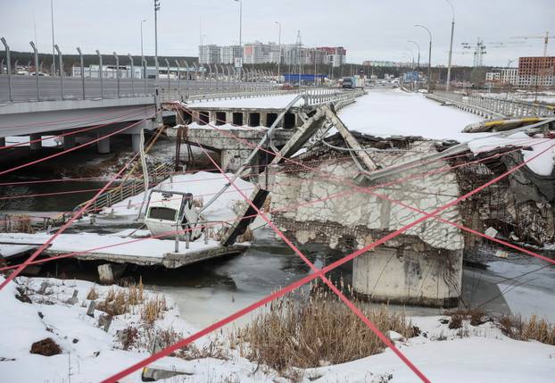 People attend a memorial event to mark the fourth anniversary of the full-scale Russian invasion in Irpin