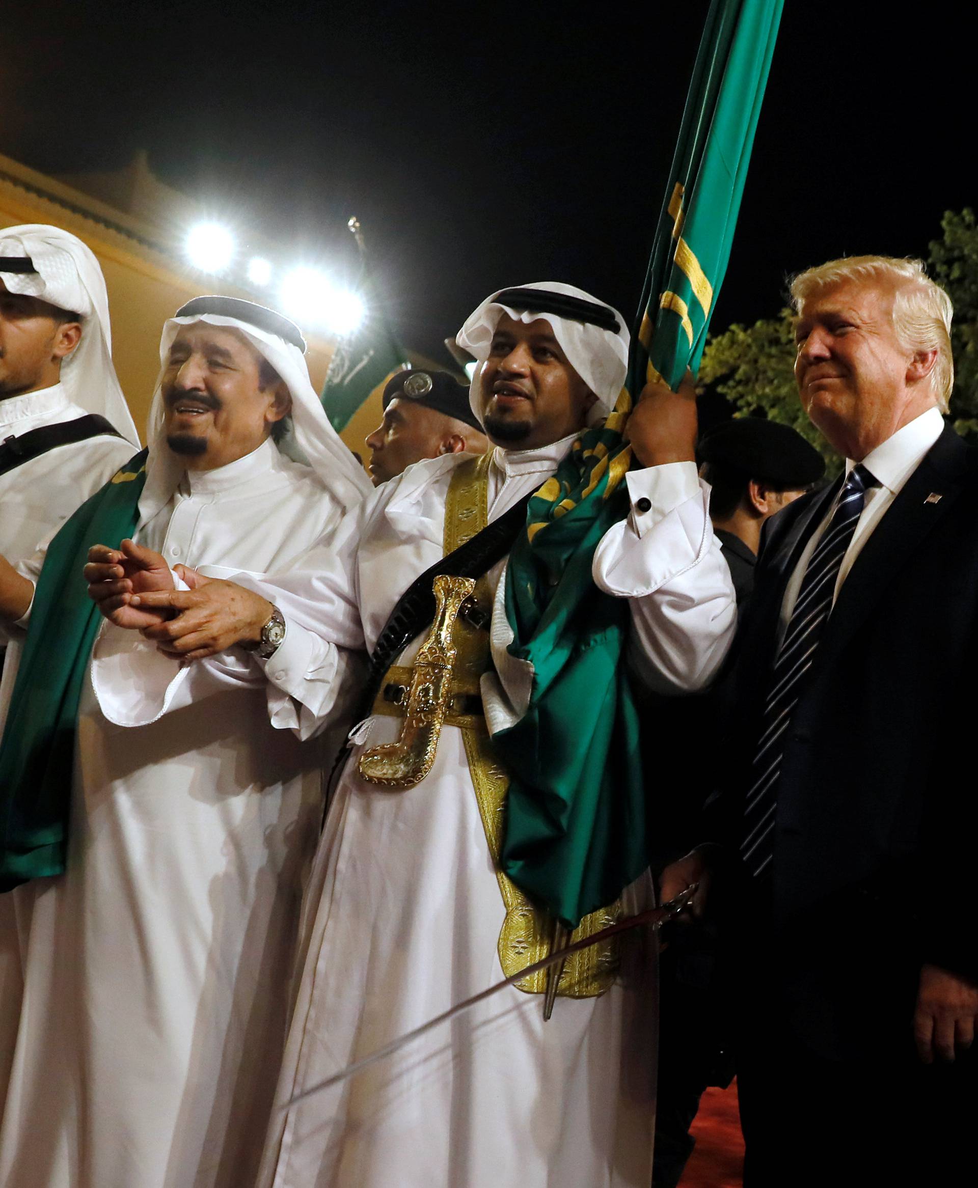 Saudi Arabia's King Salman welcomes Trump to dance with a sword during a welcome ceremony at Al Murabba Palace in Riyadh