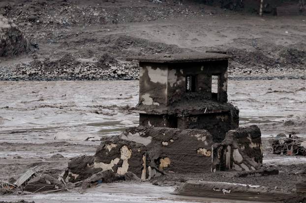 Mud covers a property following a flash flood at Trishuli, Nepal