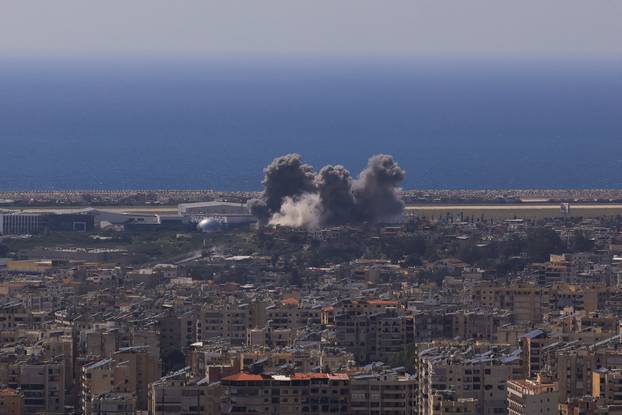 Smoke rises following an Israeli strike on the southern suburbs of Beirut