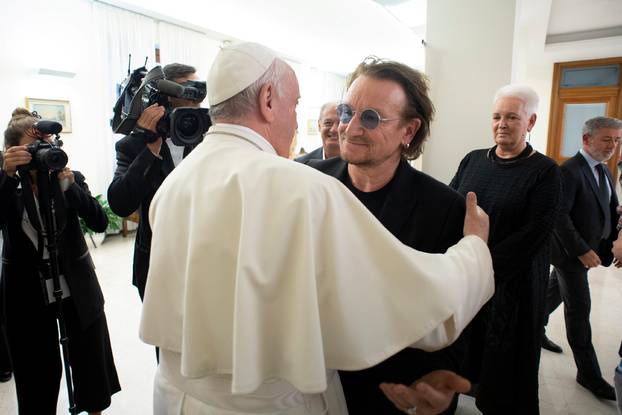 U2 rock band frontman Bono Vox meets Pope Francis at the Vatican