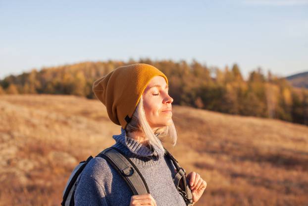 Middle,Aged,Woman,Hiking,And,Going,Camping,In,Nature.,Person