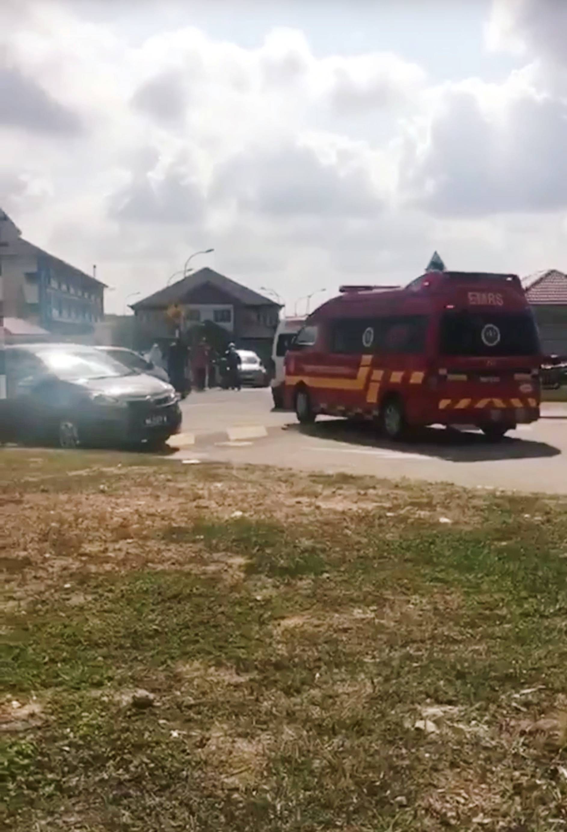 An ambulance enters a primary school after following a suspected chemical leak last week in Pasir Gudang