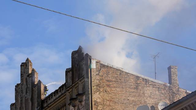 Firefighters respond to a deadly fire in a hostel in Riga