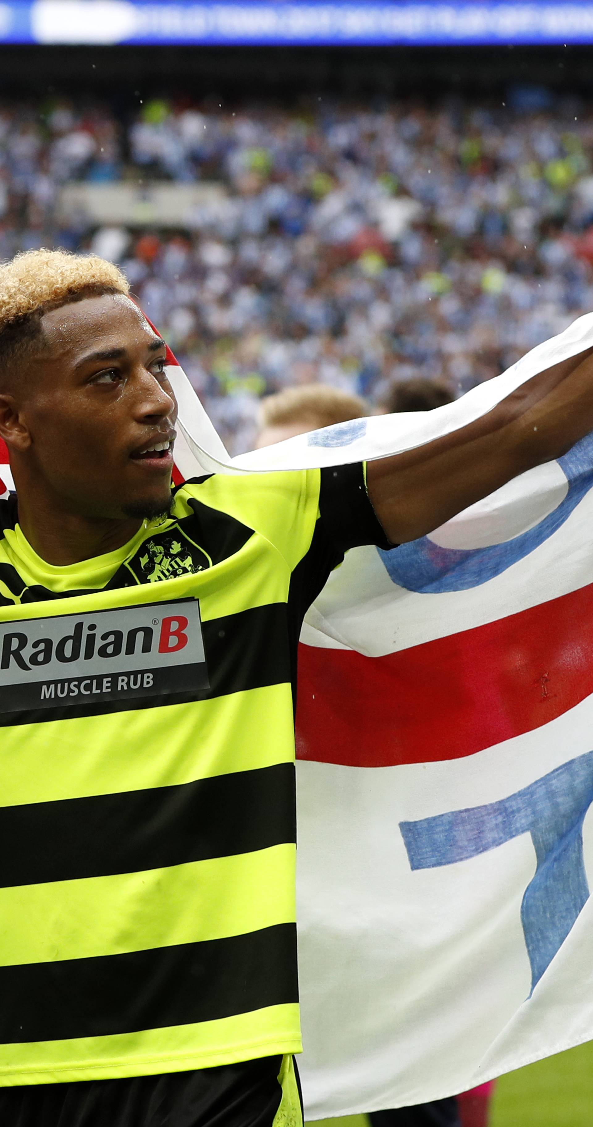 Huddersfield Town's Rajiv van La Parra celebrates after winning the Sky Bet Championship Play-Off Final and getting promoted to the Premier League