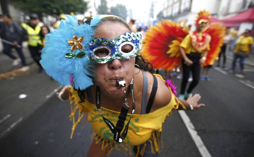 Performers participate in the children's day parade at the Notting Hill Carnival in London