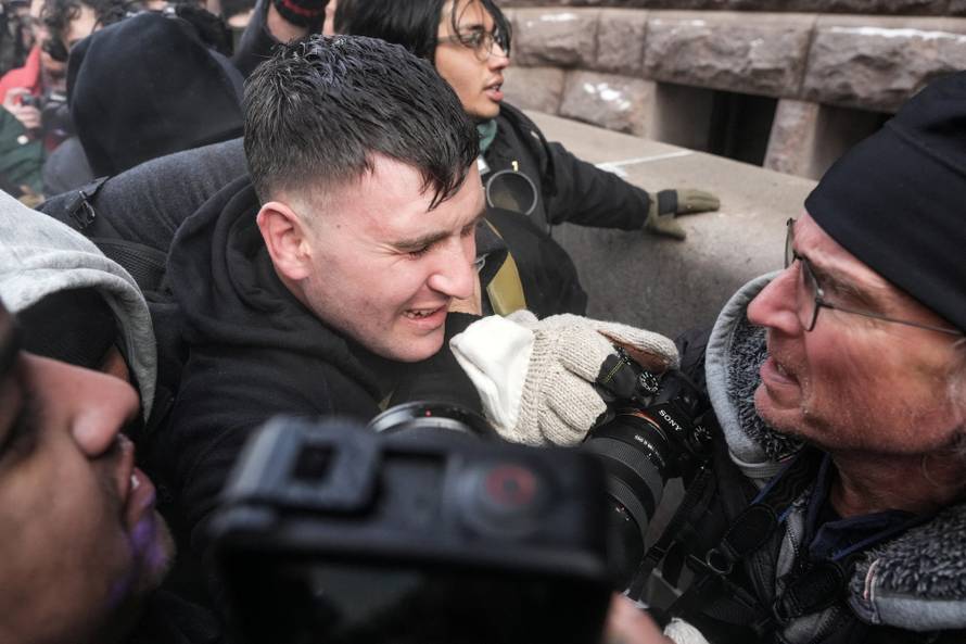 People attend the "March Against Minnesota Fraud" in Minneapolis