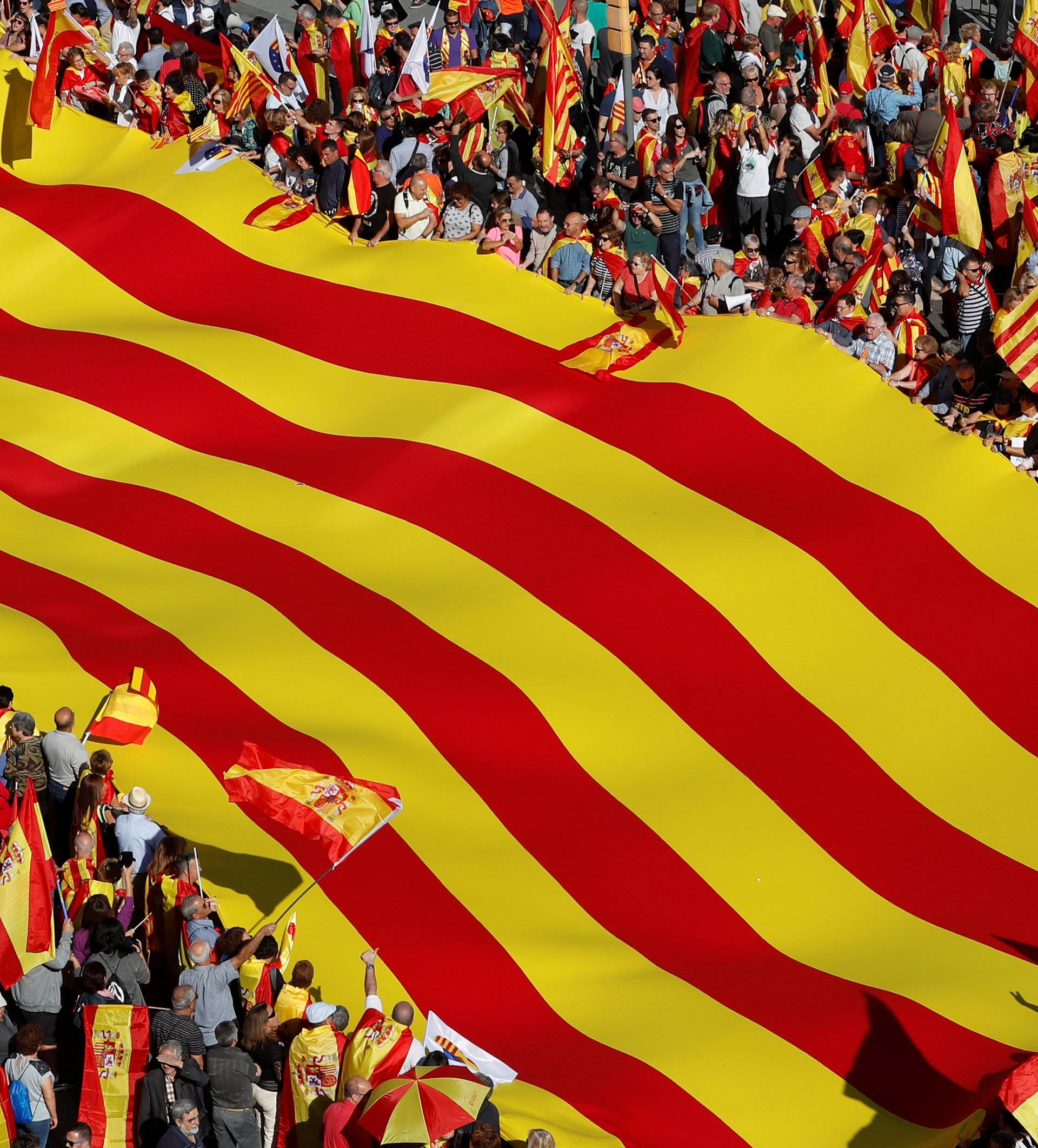 Pro-unity supporters take part in a demonstration in central Barcelona