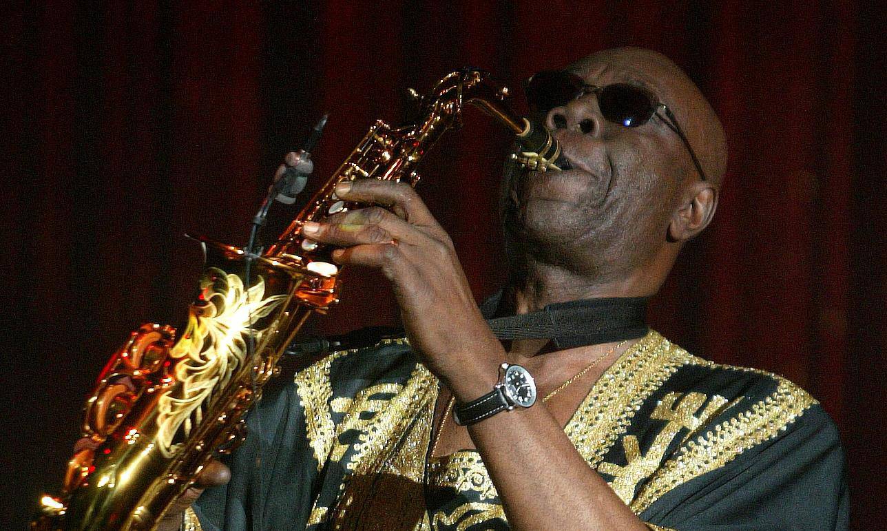 FILE PHOTO: Camoroonese musician Manu Dibango plays his saxaphone during French designer Sorbier's Spring/Summer..