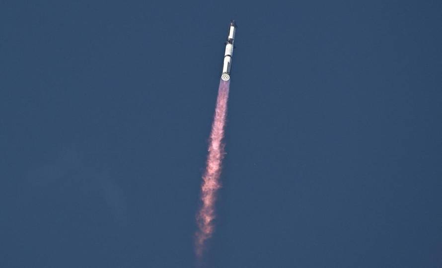 A SpaceX Super Heavy booster carrying the Starship spacecraft lifts off on its 10th test flight
